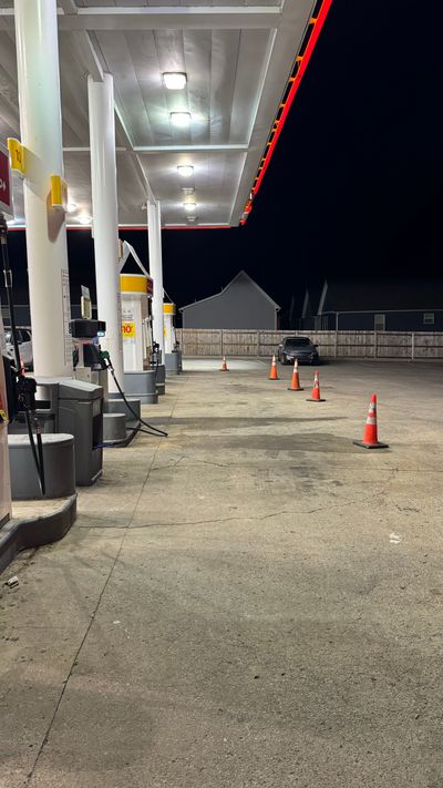 Gas station forecourt before cleaning