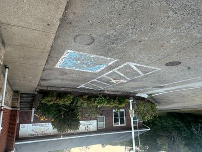 Faded parking lot striping before service